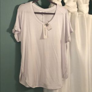 Easy, comfortable shirt. Has cuffed sleeves.